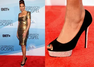 If Shoes Could Talk - Auntie Yolanda set the bar high with these black heels with a pink sole with gold flecks to match her golden dress.&nbsp;(Photos: Jason Kempin/Getty Images for BET)