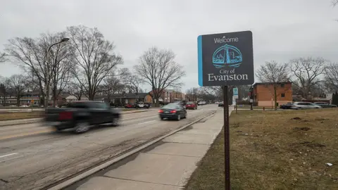 Cars drive past a sign welcoming people to the city of in Evanston, Illinois, on March 16, 2021. - A suburb in Chicago is set to become the first place in the United States to provide reparations to its Black residents, with a plan to distribute $10 million over the next decade. Evanston, home to Northwestern University and just north of Chicago along the shore of Lake Michigan, will have a city council vote March 22 on the issue, which is expected to pass. (Photo by KAMIL KRZACZYNSKI / AFP) (Photo by KAMIL KRZACZYNSKI/AFP via Getty Images)
