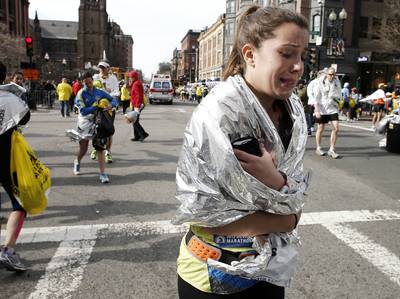 Investigators Continue Search for Suspect in Boston Marathon Bombings - Authorities are getting closer to identifying a suspect in the tragic bombings that killed three people and injured more than 170 others during Monday's Boston Marathon. According to reports, surveillance video from a department store captured a man dropping off a bag on the marathon route, although no arrests have been made.&nbsp;(Photo: AP Photo/Winslow Townson)