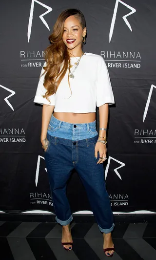 Double Take - Your eyes weren't playing tricks on you when you saw the island princess rocking double-top jeans from her River Island line. Rihanna balanced the daring denim with a cropped white tee and sandals.   (Photo: WENN.com)