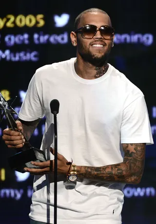 Best Male R&amp;B Artist – Chris Brown - A low-key Chris Brown took home Best Male R&amp;B Artist after responding to a firestorm of criticism and doubt with his first No. 1 album, F.A.M.E.&nbsp;&quot;I want to thank all my fans,&quot; CB said, keeping it short and sweet. &quot;I dedicate this to y'all — I appreciate everything.&quot;(Photo: Michael Buckner/Getty Images For BET)