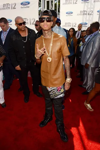 Tyga - Tyga works a tailored tan top into his flashy designer street-wear on the red carpet for the 2012 BET Awards.   (Photo: Mark Davis/Getty Images for BET)