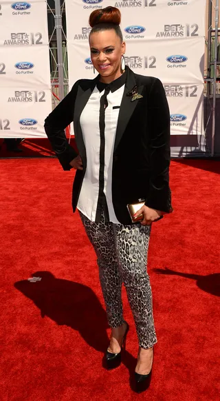 Faith Evans - Faith ditches her red carpet duds for something sexier: cheetah-print jeans and a white blouse topped with a black blazer and smooth top knot.(Photo: Jason Merritt/Getty Images For BET)