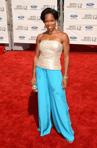 Regina King - Regina King plays with proportions, pairing her blue wide-leg trousers with a strapless top and matching clutch.(Photo: Jason Merritt/Getty Images For BET)