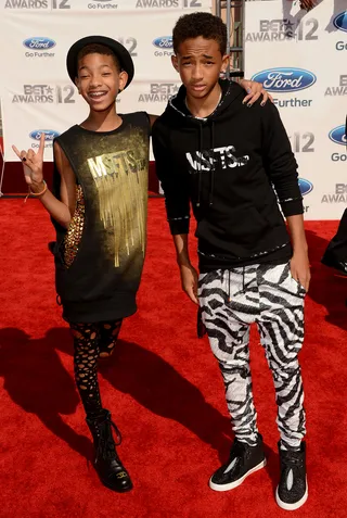 Willow and Jaden Smith - Modeling his own MSFTs creation (a black hoodie) and zebra-print trousers, the young star celebrates with sister Willow who wore the same label with stylishly holed leggings, boots and a bowler hat.(Photo: Jason Merritt/Getty Images For BET)