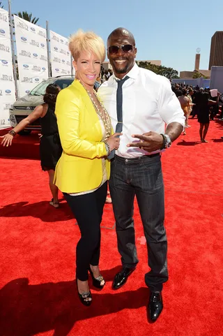 Terry and Rebecca Crews - Their onscreen chemistry is undeniable so it’s no surprise Rebecca (wearing a yellow blazer and black skinnies) is the perfect match to Terry’s casual combination.  (Photo: Mark Davis/Getty Images for BET)