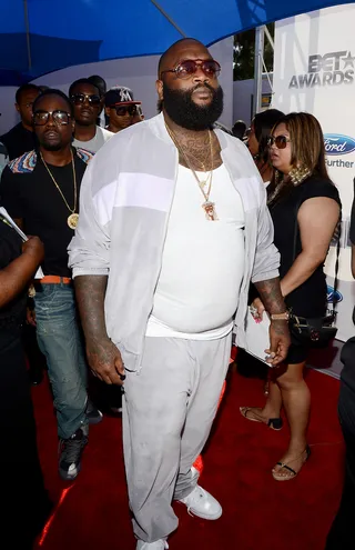 Rick Ross - Decked in a velour track suit and a clean pair of Air Force 1s, Ricky Rose keeps it cool and easy as he arrives to the Awards with his MMG in tow.  (Photo: Mark Davis/Getty Images for BET)&nbsp;