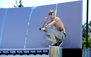 Untamed Heart - Bad Boy artist Machine Gun Kelly began his set with an impassioned speech about making his dreams come true before launching into a heartfelt performance of his single &quot;Invincible.&quot; The Ohio rapper then made the crowd roar with his hit single &quot;Wild Boy.&quot;(Photo: Earl Gibson III/Getty Images For BET)