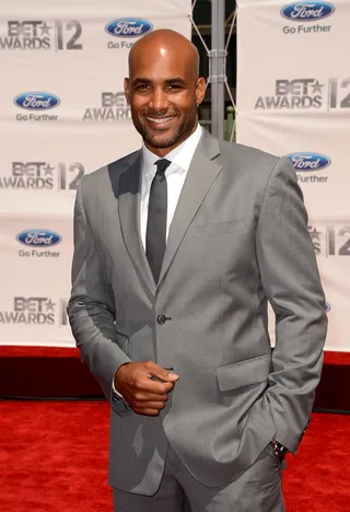 Boris Kodjoe - Boris Kodjoe suits up in a sharp gray jacket, trousers and skinny smoke tie. That smile makes whatever he puts on look so good. &nbsp;(Photo: Jason Merritt/Getty Images For BET)