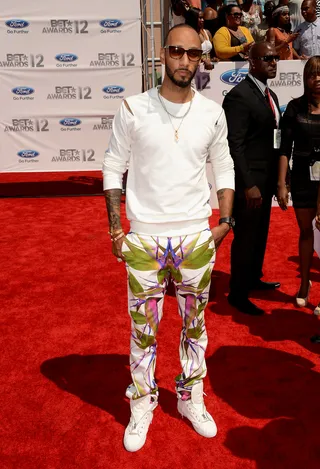 Swizz Beatz - Super producer Swizz Beatz takes a bit of a fashion risk in printed pants and a simple neutral top, both by Givency.&nbsp;  (Photo: Jason Merritt/Getty Images For BET)