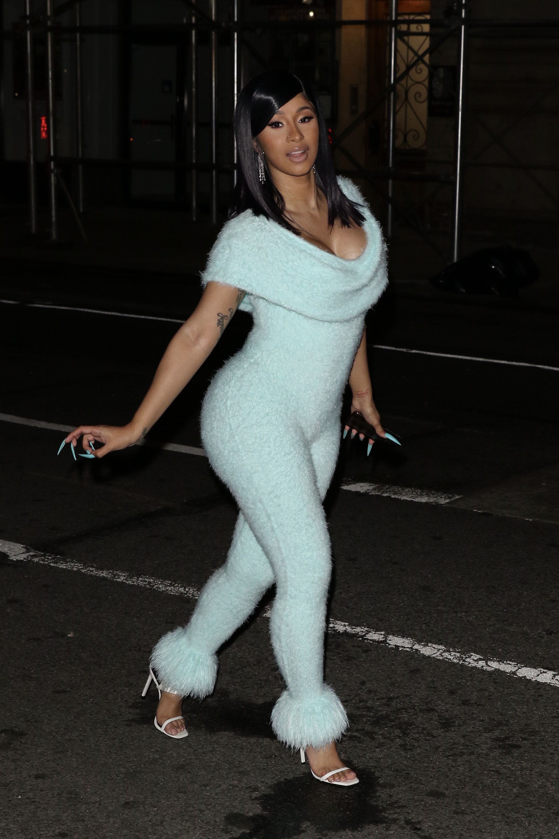 NYFW Drip - Cardi B has been giving looks for the last few days, but we expect nothing less from this fashion queen! She was spotted on her way to Rihanna's Savage X Fenty show wearing a baby blue, fuzzy jumpsuit by Mark Fast.&nbsp; (Photo: Splash News)