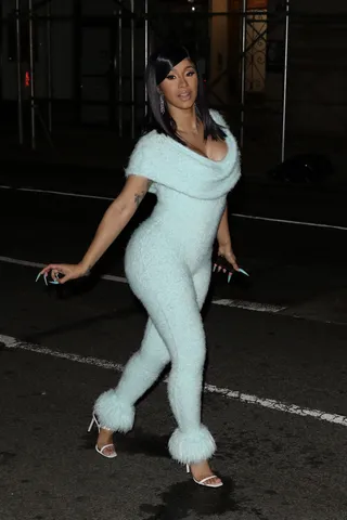 NYFW Drip - Cardi B has been giving looks for the last few days, but we expect nothing less from this fashion queen! She was spotted on her way to Rihanna's Savage X Fenty show wearing a baby blue, fuzzy jumpsuit by Mark Fast.&nbsp; (Photo: Splash News)
