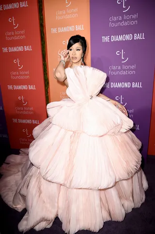 Pretty In Pink! - Styled by Kollin Carter, Cardi B's Diamond Ball outfit was quite fitting! She&nbsp;graced carpet&nbsp;looking like a poppin' princess wearing an enormous, light pink dress by Georges Hobeika, and of course diamonds by Lorriane Schwartz.&nbsp; (Photo: Steven Ferdman/Getty Images)