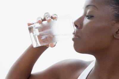 Drink Up - Drinking plenty of water flushes out toxins and nourishes, hydrates and moisturizes your skin from within.&nbsp; (Photo: Image Source/Corbis)