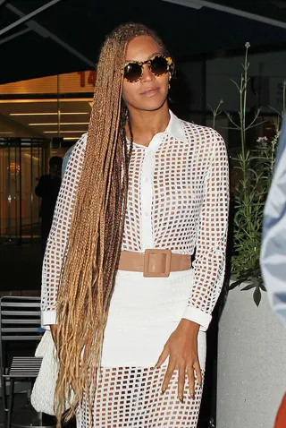 Hot Fun in the Summertime - Beyoncé&nbsp;looks ready for the heat in long braids and a cute see-through white dress and nude belt as she leaves an office building in New York City.&nbsp;(Photo: Splash News)
