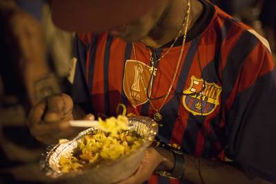 Distributing Food - An addict eats food distributed by Pastor Ricardo's church. The spiritual leader calls his efforts hit-and-miss in trying to convince the addicts to quit. (Photo: AP Photo/Felipe Dana)