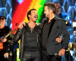 When Soul Met Country — December 4, 2013 - Lionel admitted that both classical and country music have been huge influences in his journey as songwriter and singer. Richie drove that point home by appearing in a very special performance on Country Music Television Artists of the Year show with country superstar Luke Bryan.  (Photo: Rick Diamond/Getty Images for CMT)