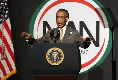 Rev. Al Sharpton Defends Teen Shoved by Police - Rev. Al Sharpton has defended a 14-year-old Bronx boy who was shoved through a window of a business by a police officer on May 17, after he was handcuffed. Javier Payne was arrested for assaulting a 39-year-old man and began trash talking an officer. The officer then pushed him. &quot;Two wrongs don't make a right,&quot; said Sharpton.&nbsp;   (Photo: John Moore/Getty Images)