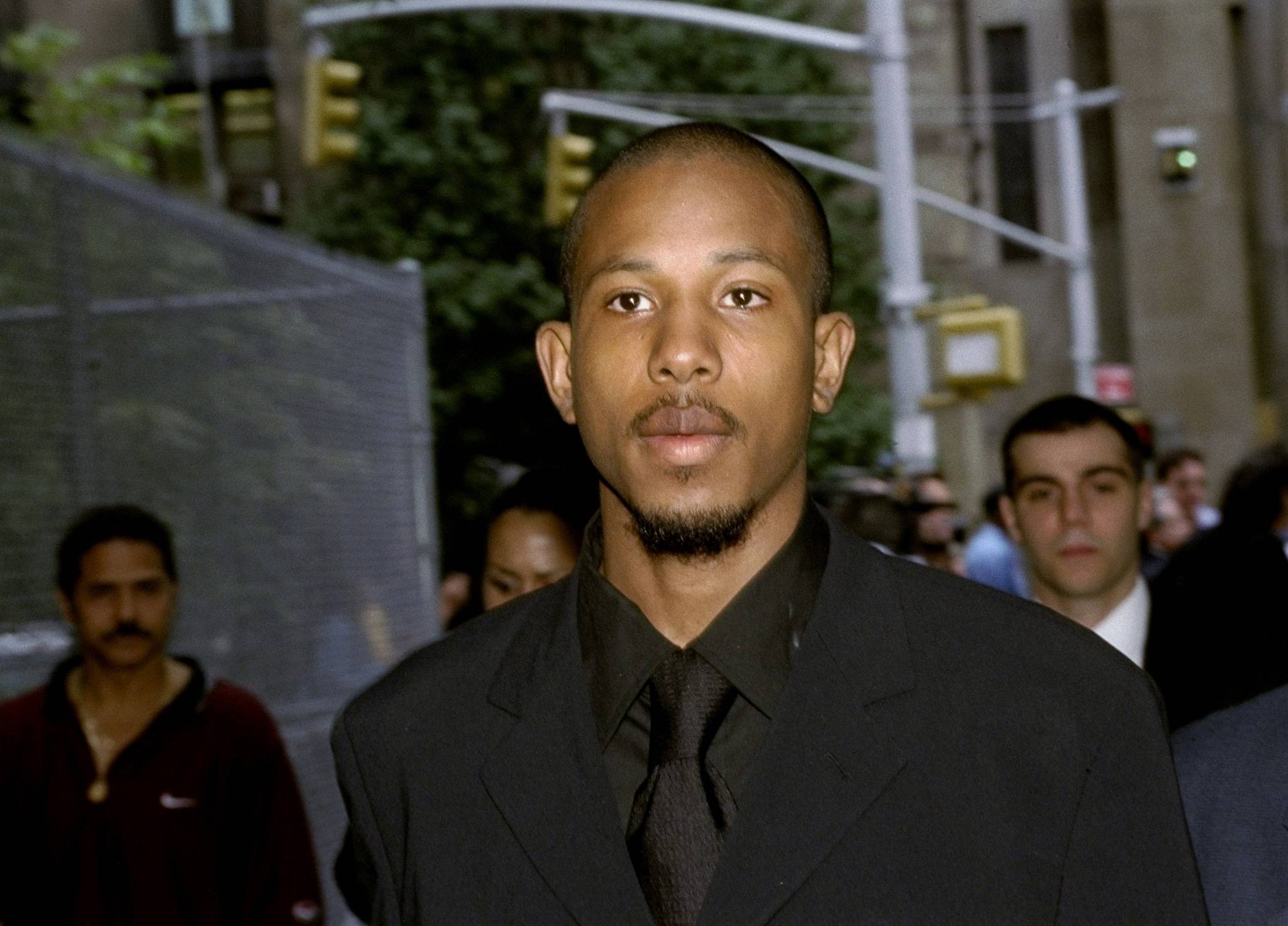 UNITED STATES - CIRCA 2000:  Jamal (Shyne) Barrow, a rap protege of Sean (Puffy) Combs, leaves Manhattan Supreme Court after a judge ordered him to return in September to set a date for his trial on gun possession charges in connection with a shooting at Club New York on W. 43rd St. last December.  (Photo by Andrew Savulich/NY Daily News Archive via Getty Images)