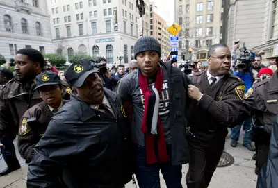Protests Broke Out Following Freddie Gray News - Lawyers met with a judge Thursday to schedule another date for Officer William Porter to be retried in the case. They will continue meeting to confirm the date for the next trial in the coming days. Marches broke out but ended peacefully following the news.  (Photo: Jose Luis Magana, AP PHOTO)