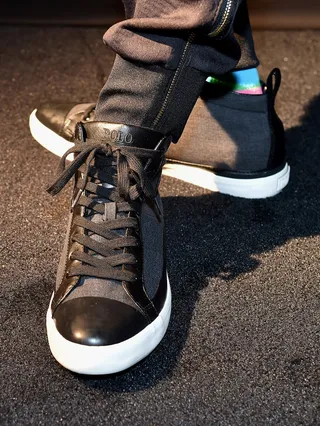 Snoop Dogg - black Polo Clarke canvas sneaker - Uncle Snoop broke out a subtle yet classy pair of Ralph Lauren sneakers for his turn on the green carpet. In his own words, he decided on wearing these because they were "fit for a dime and when you're Snoop Dogg you're a ten."(Photo: Paras Griffin/BET/Getty Images for BET Networks)