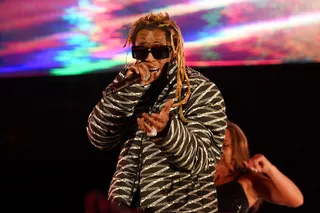 FEB 15:&nbsp;Lil Wayne&nbsp; - &nbsp;Lil Wayne performs during the 2020 State Farm All-Star Saturday Night in a Balenciaga logo puffer coat.&nbsp;(Photo: Kevin Mazur/Getty Images)