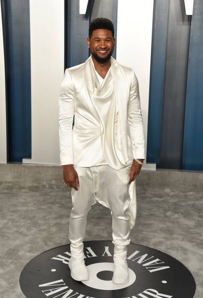 Usher - Usher is ecstatic to be attending the 2020 Vanity Fair Oscar Party. The smiling R&amp;B singer opted to style in a satin white ‘fit.(Photo by John Shearer/Getty Images) (Photo by John Shearer/Getty Images)