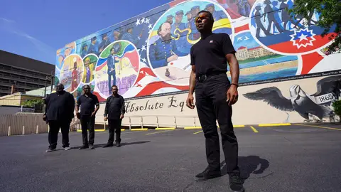 (L-R) Artists Dantrel Boone, Samson Adenugba, Joshua Bennett, and principal artist Reginald C. Adams pose in front of their "Absolute Equality" mural in Galveston, Texas, on June 16, 2021. - The mural is to be dedicated on June 19, now the Juneteenth National Independence Day national holiday, to celebrate the day in Galveston in 1865 when the last enslaved African Americans learned that they were free. - RESTRICTED TO EDITORIAL USE - MANDATORY MENTION OF THE ARTIST UPON PUBLICATION - TO ILLUSTRATE THE EVENT AS SPECIFIED IN THE CAPTION (Photo by Francois PICARD / AFP) / RESTRICTED TO EDITORIAL USE - MANDATORY MENTION OF THE ARTIST UPON PUBLICATION - TO ILLUSTRATE THE EVENT AS SPECIFIED IN THE CAPTION / RESTRICTED TO EDITORIAL USE - MANDATORY MENTION OF THE ARTIST UPON PUBLICATION - TO ILLUSTRATE THE EVENT AS SPECIFIED IN THE CAPTION (Photo by FRANCOIS PICARD/AFP via Getty Images)