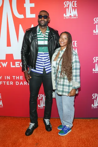 LeBron James and Savannah James&nbsp; - LeBron and Savannah&nbsp;James attends the "Space Jam: A New Legacy Party" in The Park After Dark at Six Flags Magic Mountain. Savannah rocked a denim and plaid look with a pair of Aleali May x Air Jordan 1's. While LeBron wore a Prada look. They are so stylish! (Photo: Getty Images)