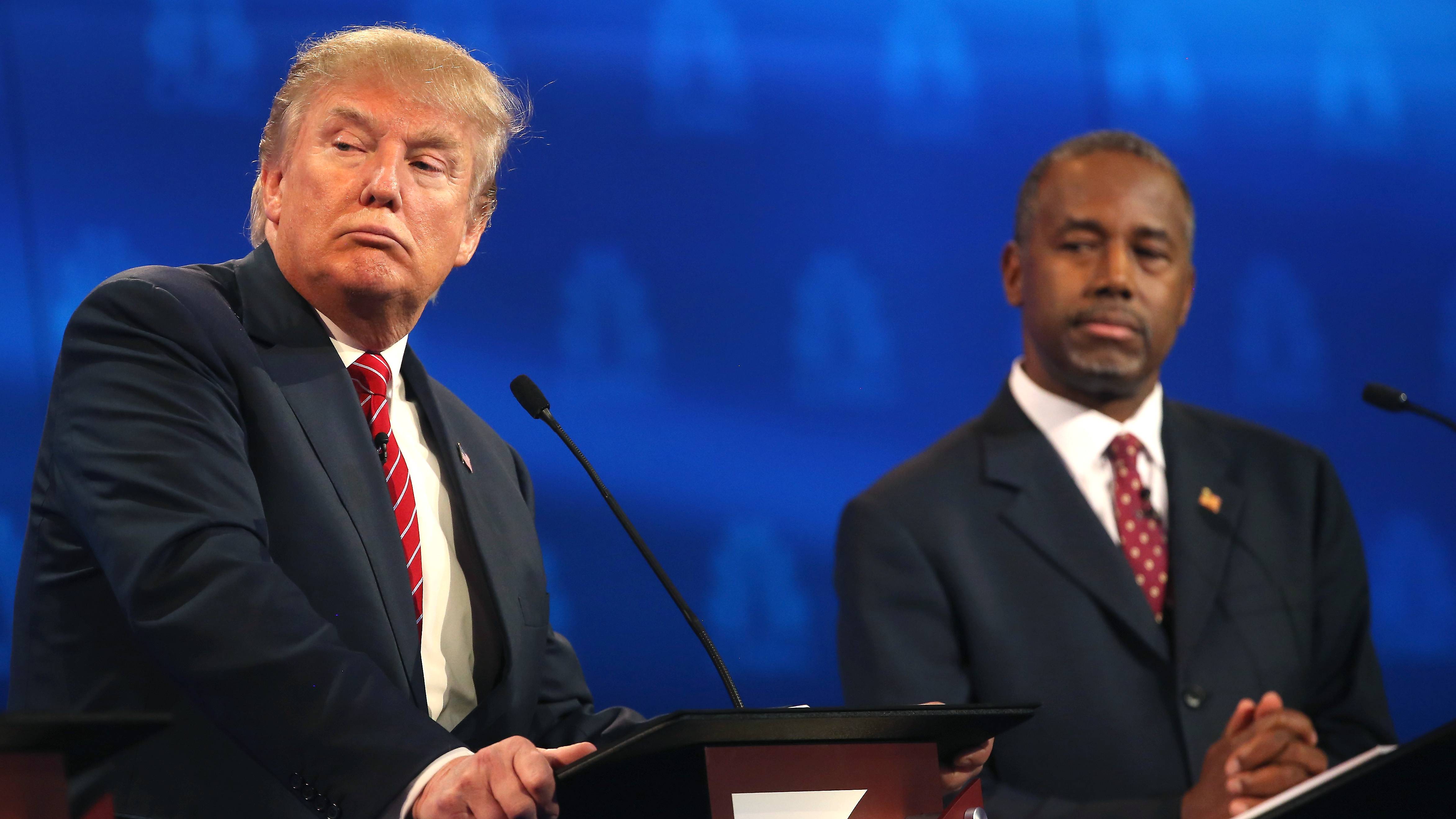 BOULDER, CO - OCTOBER 28:  Presidential candidate Donald Trump pauses while Ben Carson  looks on during the CNBC Republican Presidential Debate at University of Colorados Coors Events Center October 28, 2015 in Boulder, Colorado.  Fourteen Republican presidential candidates are participating in the third set of Republican presidential debates.  (Photo by Justin Sullivan/Getty Images)
