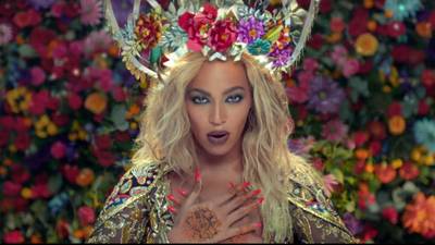 Floral Formation - In living color, Bey takes over this performance scene wearing a crown filled with flowers atop her signature blonde tresses.(Photo:&nbsp;Parlophone)