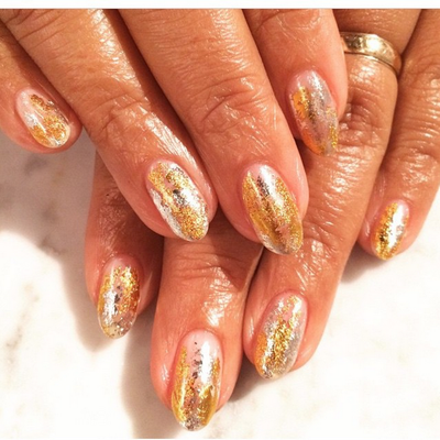 Lisa Price - The Carol’s Daughter founder keeps those curls on-point, and her nails are no exception! Gold-flecked and gorgeous.   (Photo: Lisa Price via Instagram)