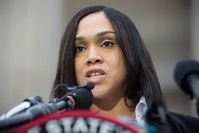 Prosecutor Dreams - Mosby knew she wanted to be a prosecutor from a young age when her 17-year-old cousin was killed on her doorstep after he was mistaken for a drug dealer. (Photo: Andrew Burton/Getty Images)