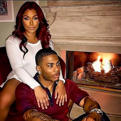 Nobody Better! - Nelly and Miss Jackson sit fireside; Now this is beautiful.   (Photo: Derrtymo via Instagram)