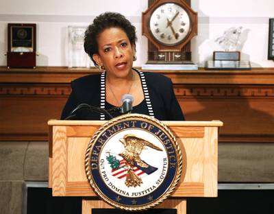 The new attorney general's first day in office was an initiation by fire. - Literally. Like other leaders, Loretta Lynch condemned the violence. &quot;I want to make it clear once again that these senseless acts of violence are not only a grave danger to the community — and they must stop — but they are also counterproductive to the ultimate goal here, which is developing a respectful conversation within the Baltimore community and across the nation about the way our law enforcement officers interact with the residents that we are charged to serve and to protect,&quot; she said. Some people say she should channel her inner Eric Holder and speak to residents in person.  (Photo: Mark Wilson/Getty Images)