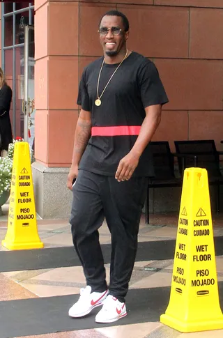 Diddy Doin' Work - Sean Combs is all smiles as he leaves an office in Beverly Hills wearing all black with a red stripe logo. (Photo: WENN.com)