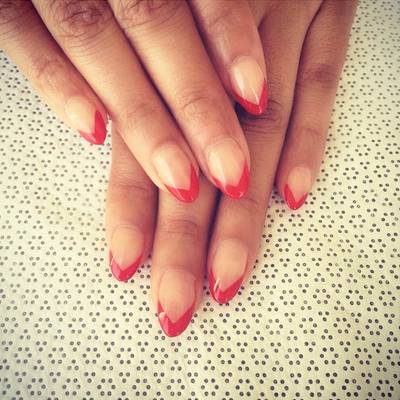 Evelyn Lozada - How sexy are these scarlet-kissed tips against a shiny nude canvas?  (Photo: Evelyn Lozada via Instagram)