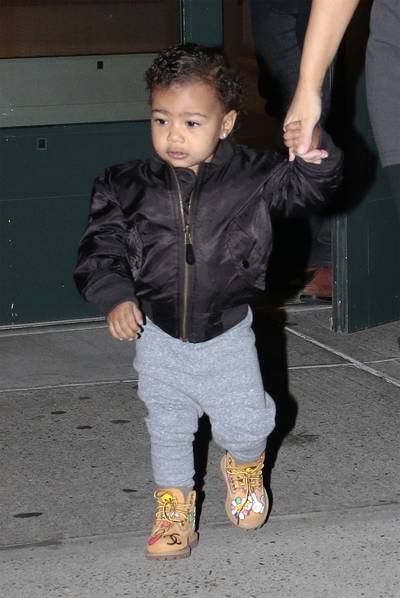 Don't Sweat Me - Bomber jacket x Joggers x Timbs. North West has more #babyswag than most grownups we know. (Photo: Splash News)