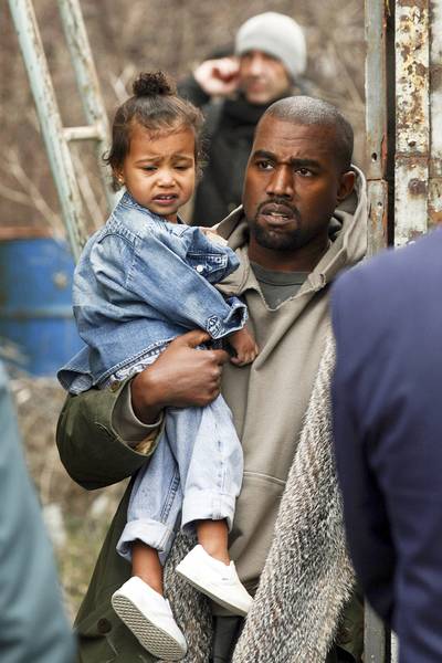 Denim Duds - North hits another fashion high note during her recent trip to Armenia with her parents. She nails the over-size&nbsp;denim look and messy top-not.&nbsp; (Photo: PacificCoastNews)