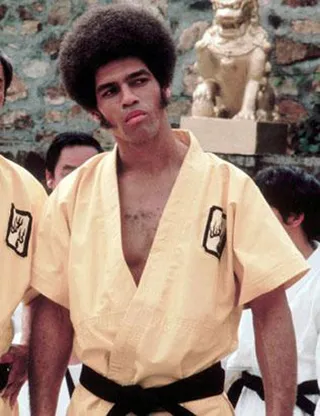 Jim Kelly&nbsp; - On June 29, martial arts icon Jim Kelly, 67, died of cancer. With his passing American cinema lost the first Black action superhero of the big screen. Kelly became a superstar when he was hired to star alongside Bruce Lee in the karate classic Enter the Dragon. Afterwards, Kelly (literally) kicked down the doors for future Black action stars when he landed leading roles in '70s blaxploitation hits like Black Belt Jones and Three the Hard Way.&nbsp;Here's a look at other black actors who blazed a trail as action heroes.  (Photo: Warner Bros Pictures)