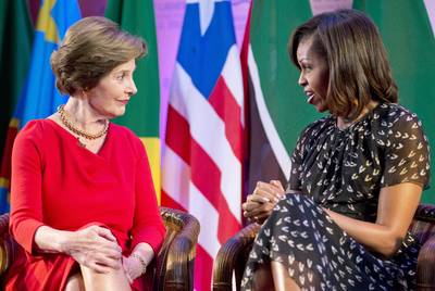 First Ladies Club - On Aug. 6, First Lady Michelle Obama and former First Lady Laura Bush will host a daylong spouses symposium that will focus on the impact of investments in education, health and public-private partnerships.   (Photo: Carolyn Kaster/AP Photo)