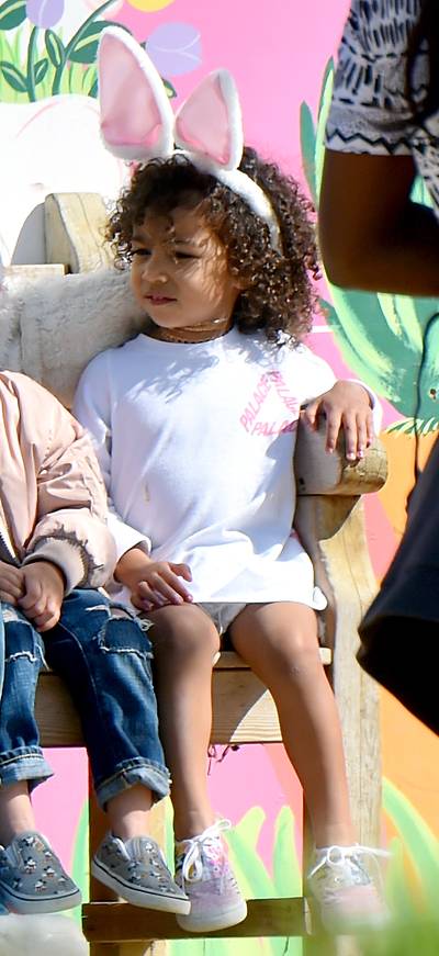 Bunny Baby - Nori nails the whole Easter 'fit thing while hunting for eggs with her mom and cousin&nbsp;at Underwood Family Farms in L.A. Can we talk about how on fleek her curls are?(Photo: Fern / Splash News)