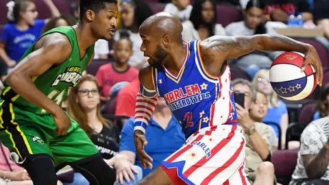 LAS VEGAS, NEVADA - AUGUST 25:  Carlos "Dizzy" English #2 of the Harlem Globetrotters drives against Shaquille Burrell #11 of the Washington Generals during their exhibition game at the Orleans Arena on August 25, 2019 in Las Vegas, Nevada.  (Photo by Ethan Miller/Getty Images)