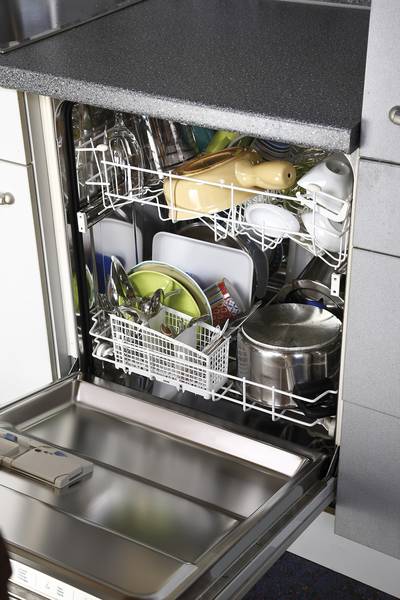 Skip the Drying Cycle in the Dishwasher - Letting your dishes air dry rather than using the heat setting cuts the energy required per load by up to 20 percent. Try running loads before bedtime, then open the door and let them dry overnight.   (Photo: Creativ Studio Heinemann/Westend61/Corbis)