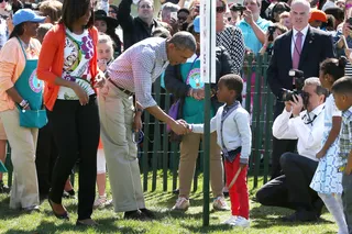 Good Job! - The president congratulates a little boy for a roll well done.(Photo: Mark Wilson/Getty Images)