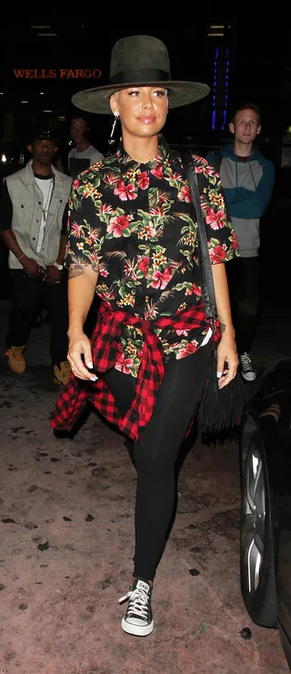 Mix It Up - Amber Rose rocks a Pharrell-inspired topper and floral and plaid shirts as she leaves On the Rox in West Hollywood, CA.(Photo: Calderon / Splash News)
