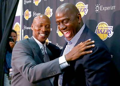 Magic, Kareem Applaud Lakers' Hiring of Scott - Now, that's a welcoming party. Magic Johnson and Kareem Abdul-Jabbar were on hand Tuesday to help introduce their former teammate, Byron Scott, as the new Los Angeles Lakers' head coach.&nbsp;The three were former teammates during the Lakers &quot;Showtime&quot; era of the 1980s.&nbsp;&nbsp;(Photo: Jeff Gross/Getty Images)