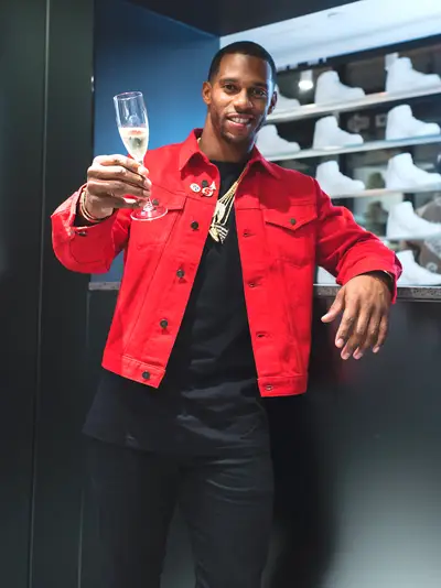 Raise Your Glass - Victor Cruz makes a toast at the Kith grand opening dinner with Carbone and Ruffino Wines.(Photo: Tyler Mansour/ KITH)