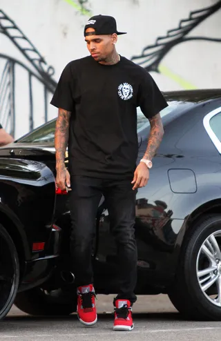 Black on Black on Black - Chris Brown is seen getting out of his car in Hollywood, CA, wearing a Soul Assassins T-shirt that says, &quot;Paint It Black.&quot;(Photo: Ajax / Splash News)&nbsp;