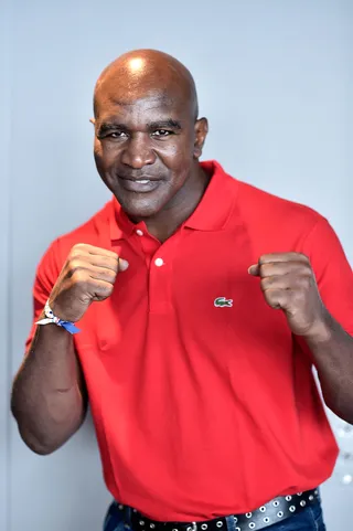Evander Holyfield - The boxer has 11 children with six different women. His son Elijah Holyfield was recently committed to play football for the University of Georgia.  (Photo: Pascal Le Segretain/Getty Images For Sportel Monaco)